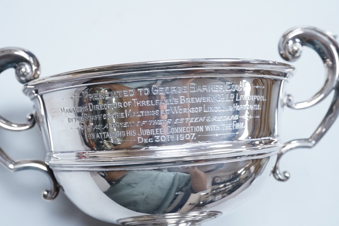 An Edwardian silver two handled presentation pedestal bowl by James Dixon & Sons, Sheffield, 1907, with engraved inscription, diameter 14.8cm excluding the handles, 14.3oz.
